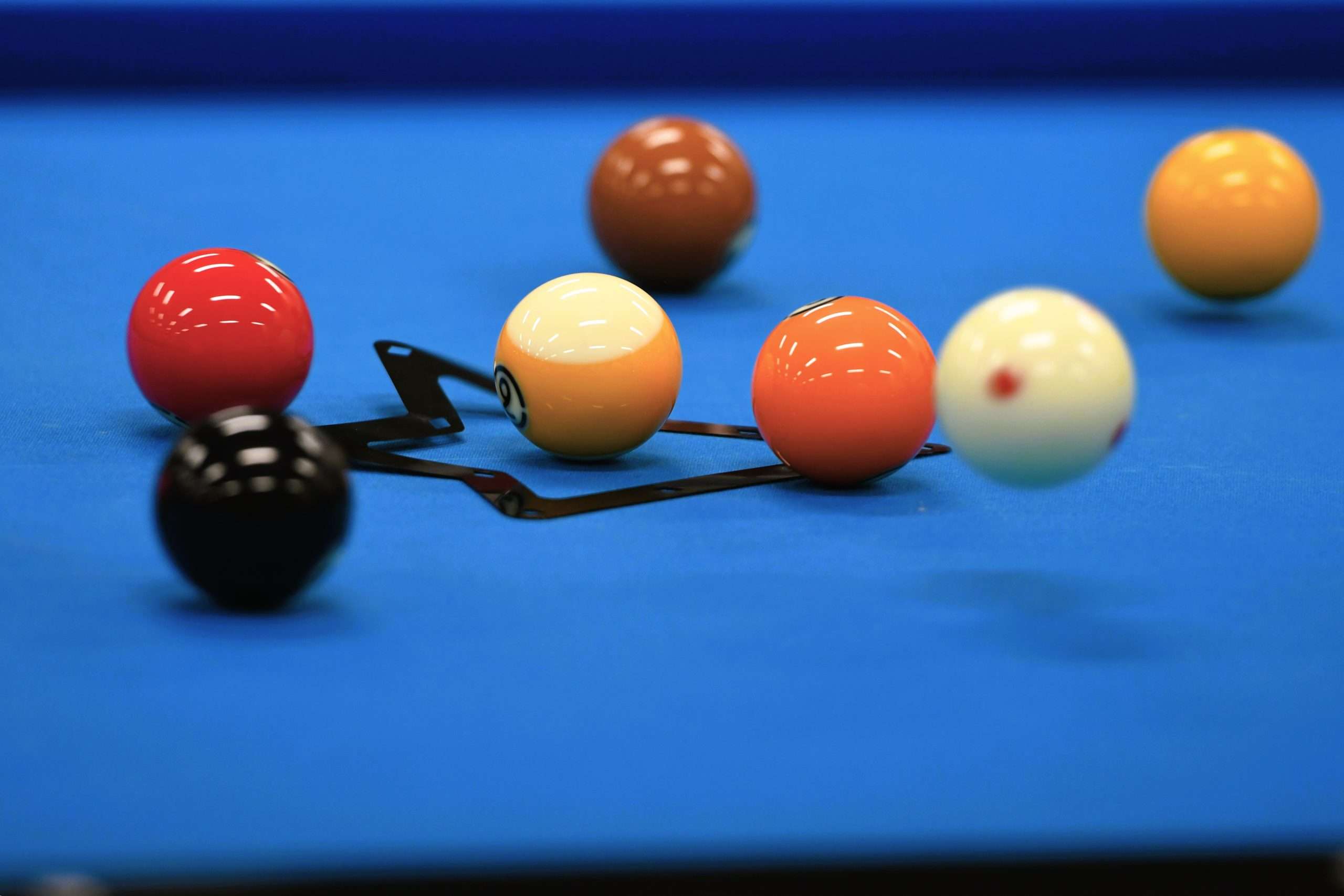 billiard balls on a blue table