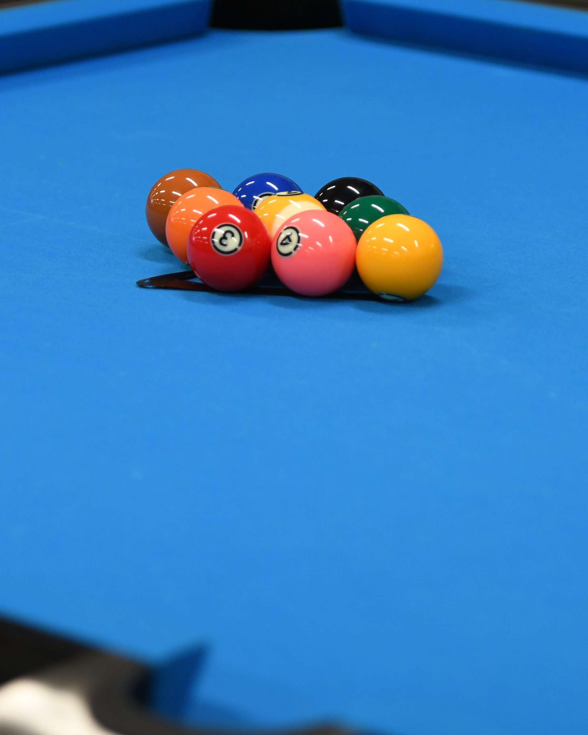 billiard balls on a blue table